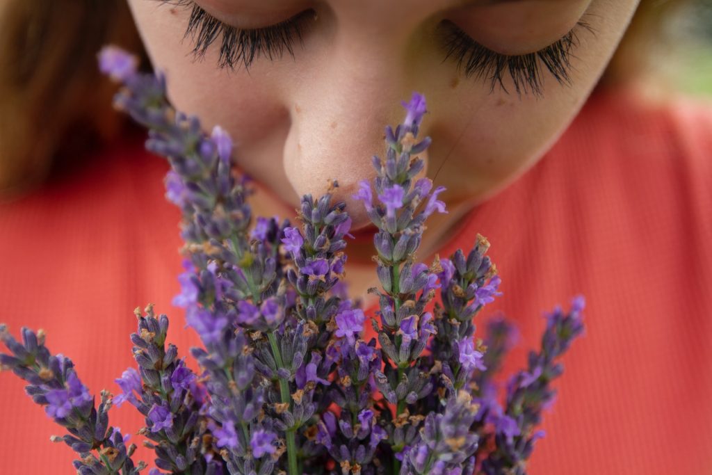 Woman smelling jasmine